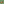         Bowl of noodles with vegetables and a side of sauce on a green background